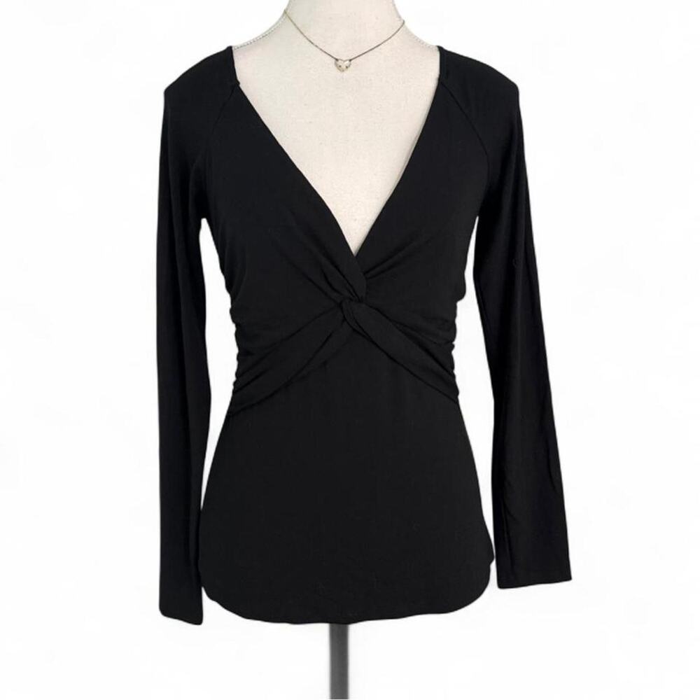 Cache black long sleeve top with twist front and open back. Size M night in nyc
